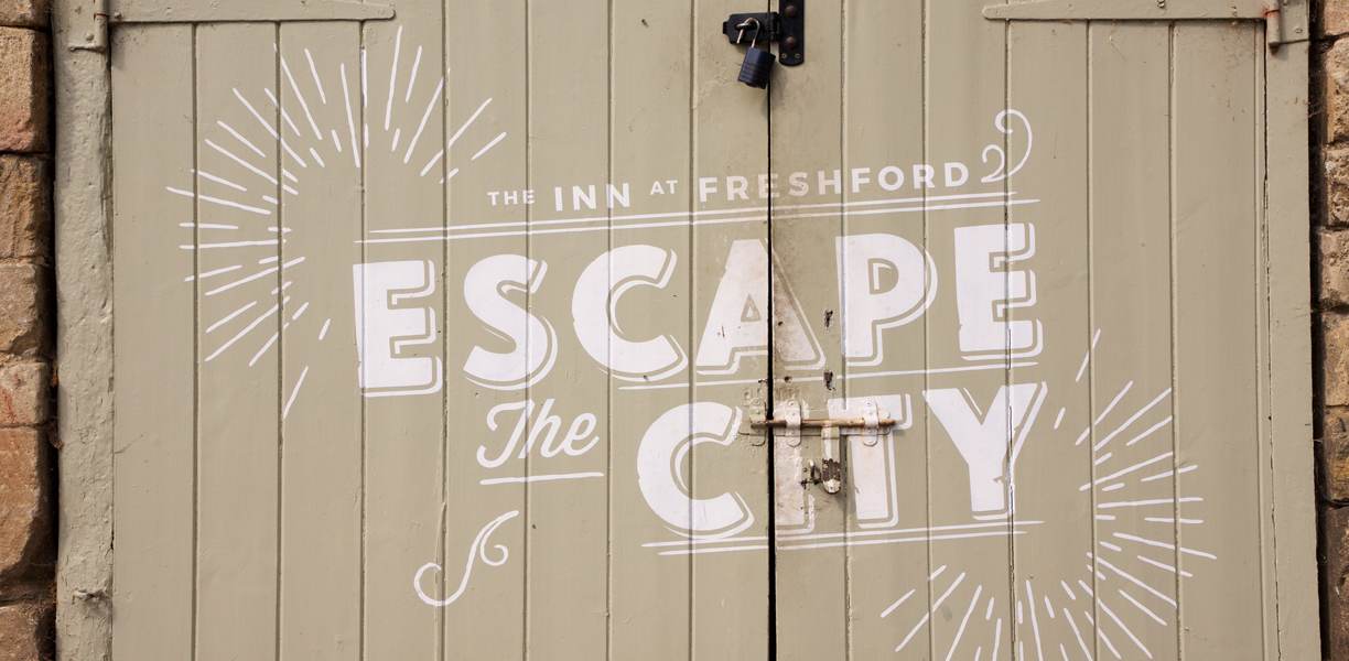 sign reading Escape the City