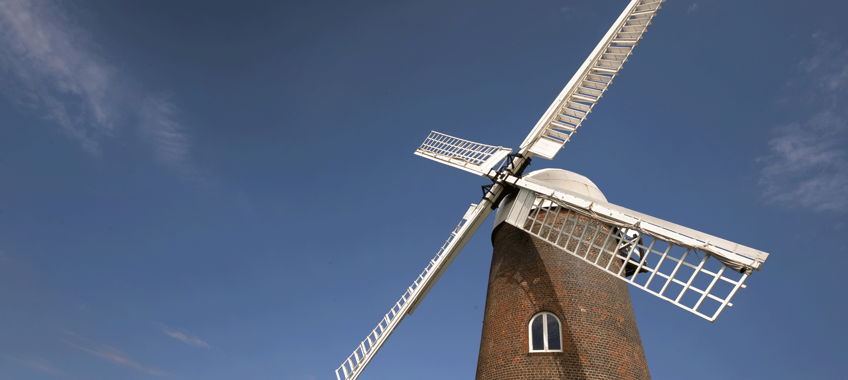 Windmill with bright blue sky