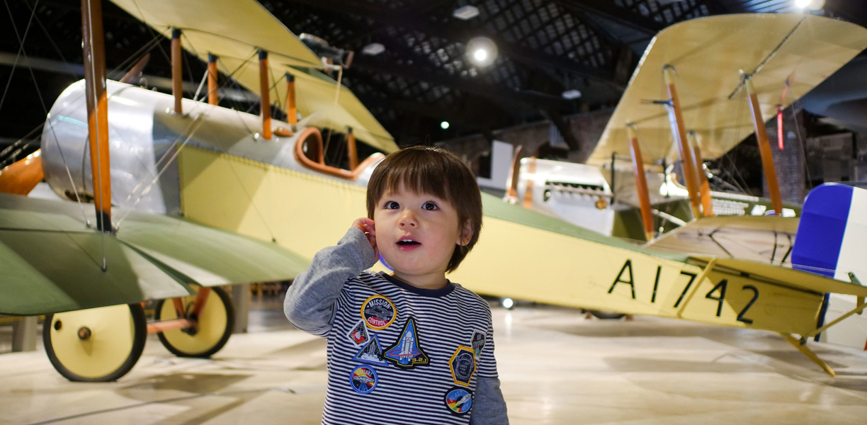 A young child with an old plane