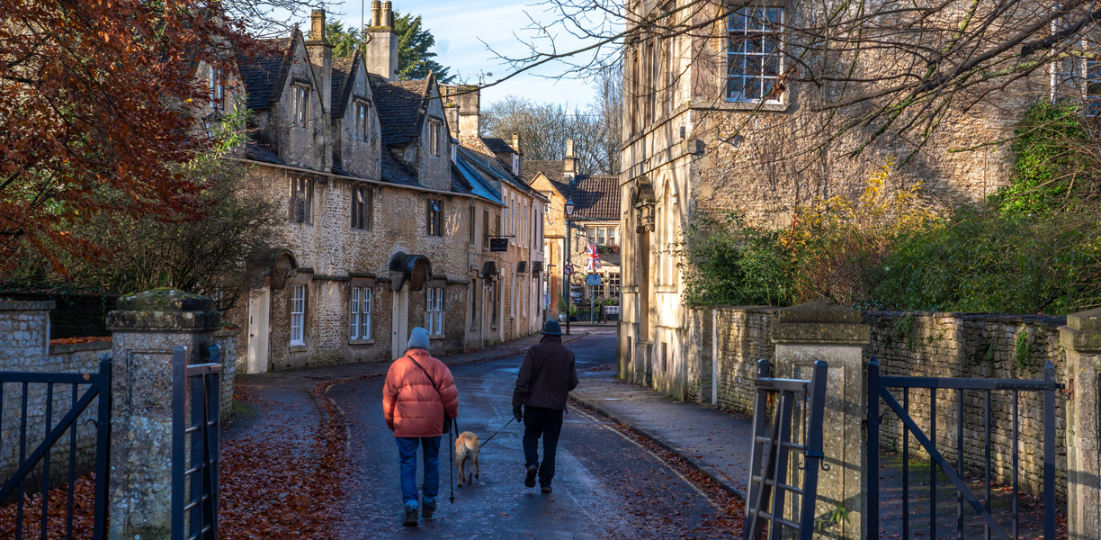 Couple walking between old stone houses