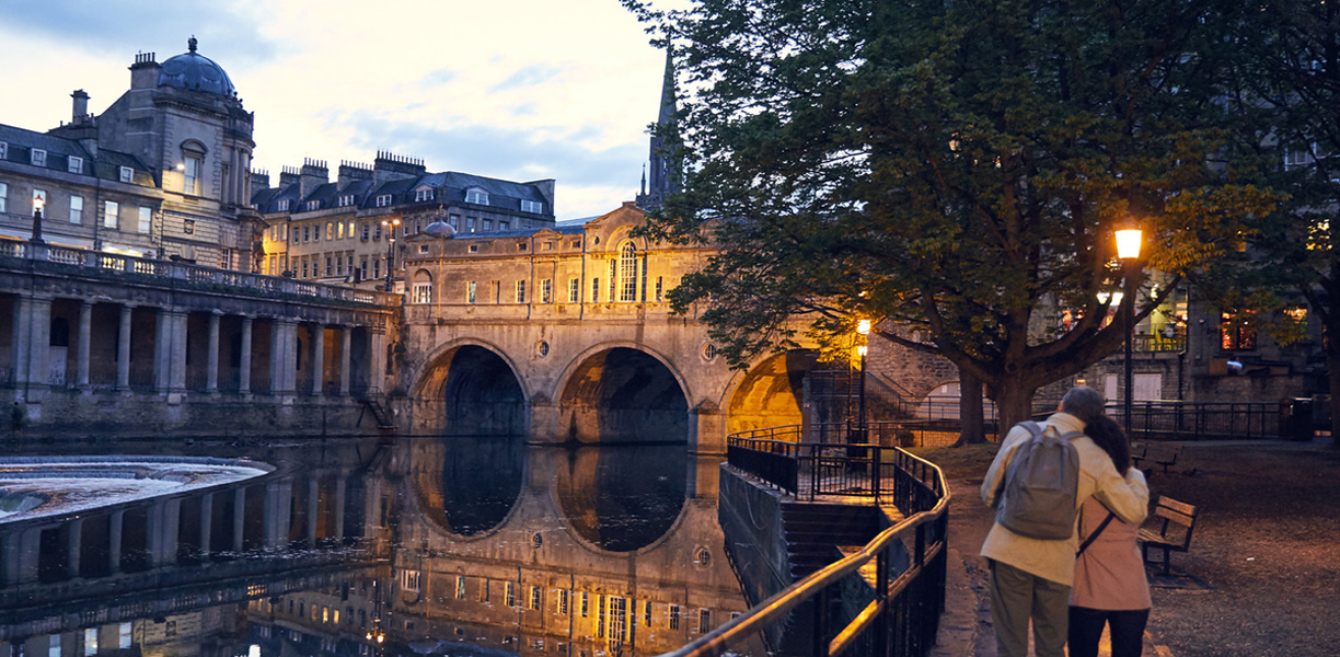 couple in bath looking at the river