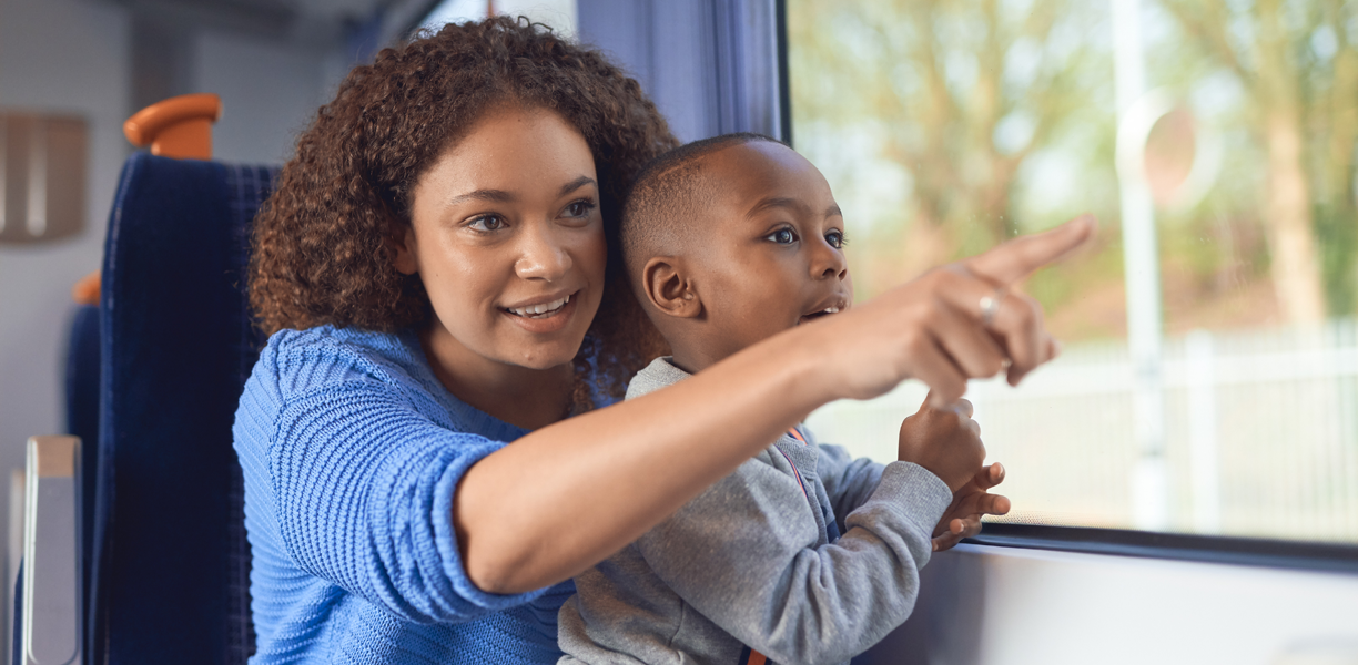 Woman travelling on train with small child