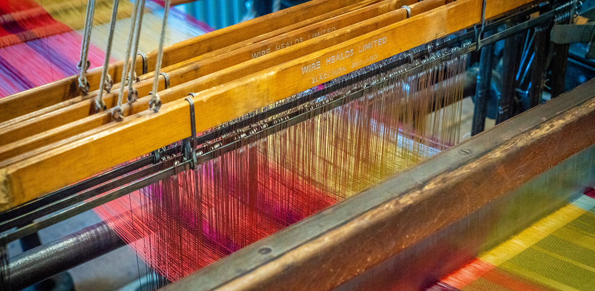 Loom weaving colourful silks