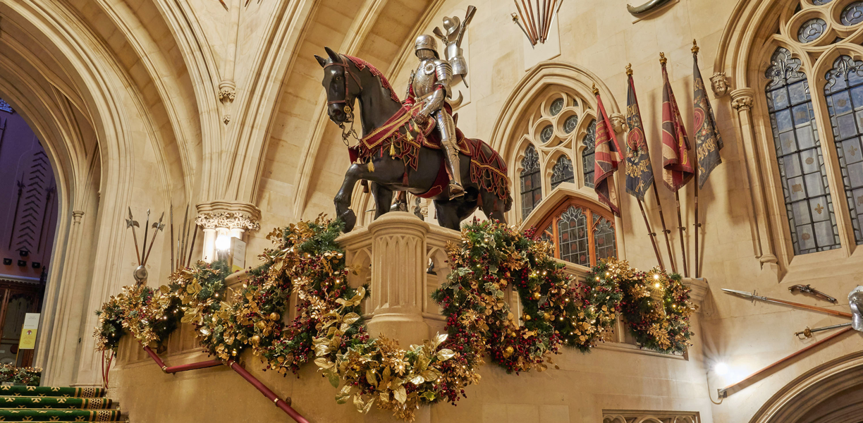 statues surrounded by christmas decorations