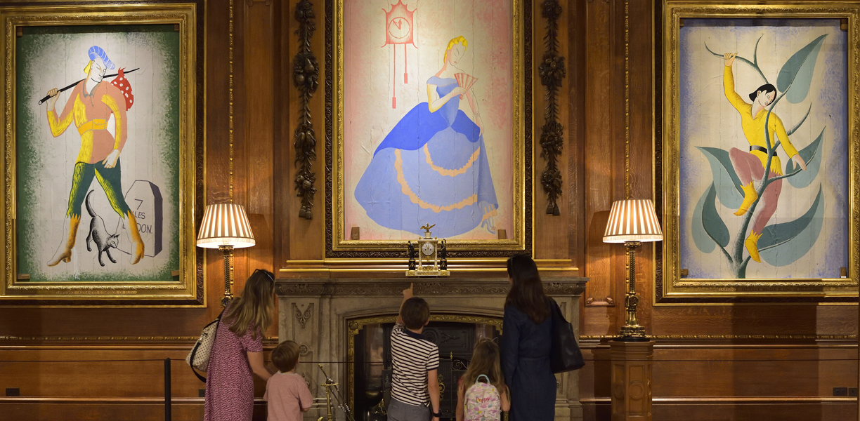 family looking at pantomime artwork